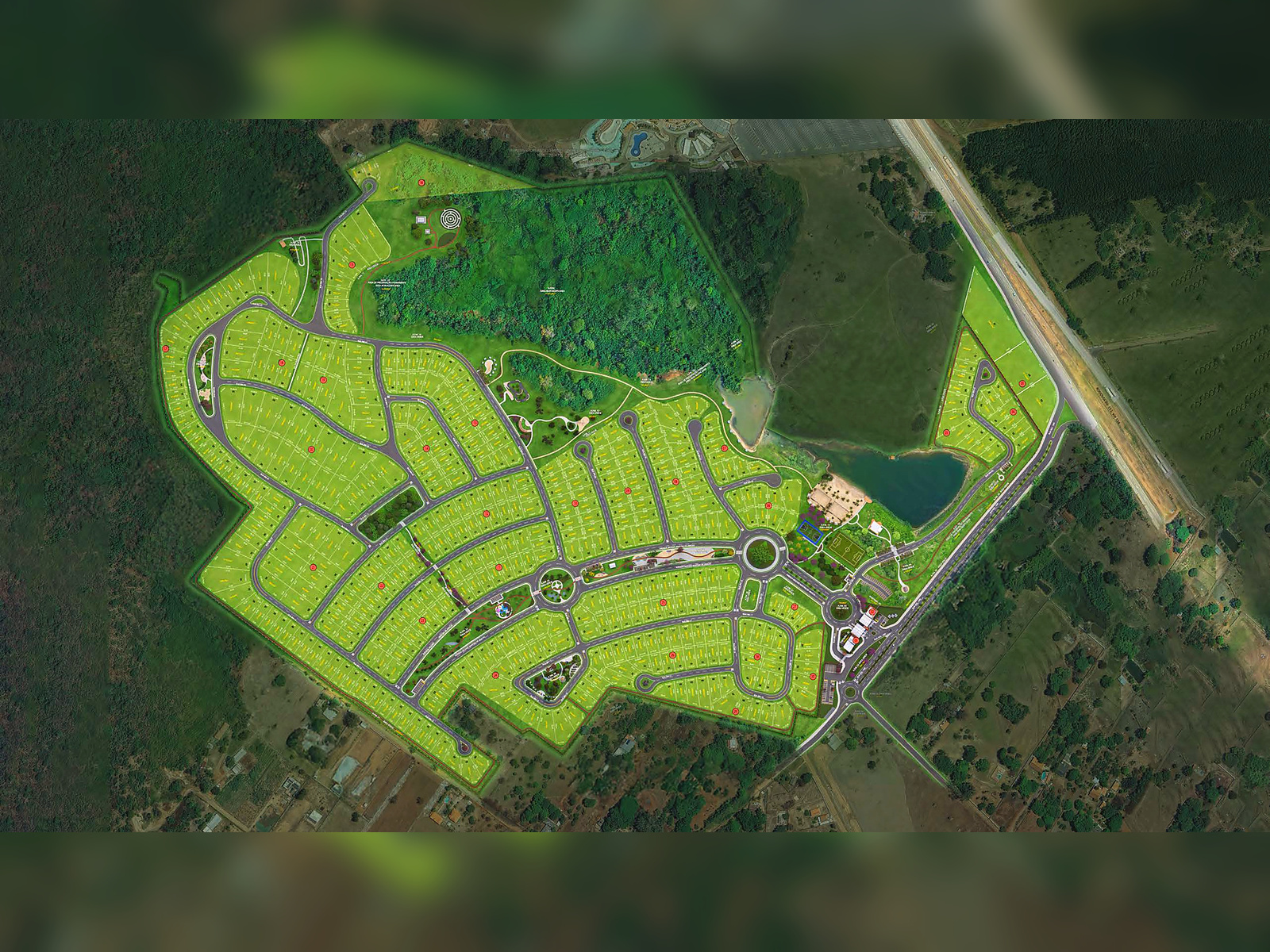 Vista aérea da implantação do Relíquia Banana Menina mostrando os lotes, lago e áreas verdes